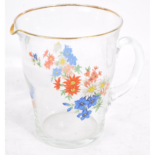 36 - A vintage 20th century glass lemonade set. Comprising of a tapering jug with gilt lip and carry hand... 