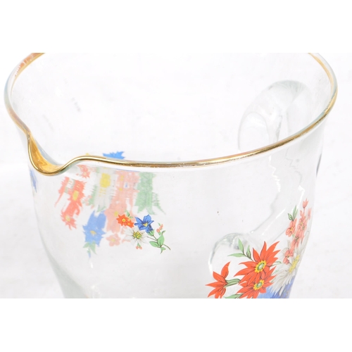 36 - A vintage 20th century glass lemonade set. Comprising of a tapering jug with gilt lip and carry hand... 