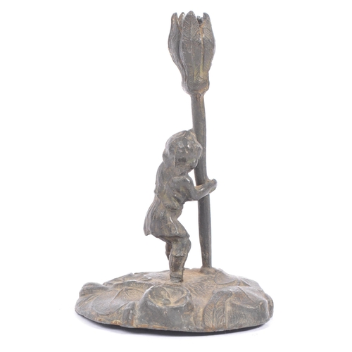 361 - A late 19th / early 20th century pewter 'Cecily Barker' style candlestick holder. Small boy / girl h... 