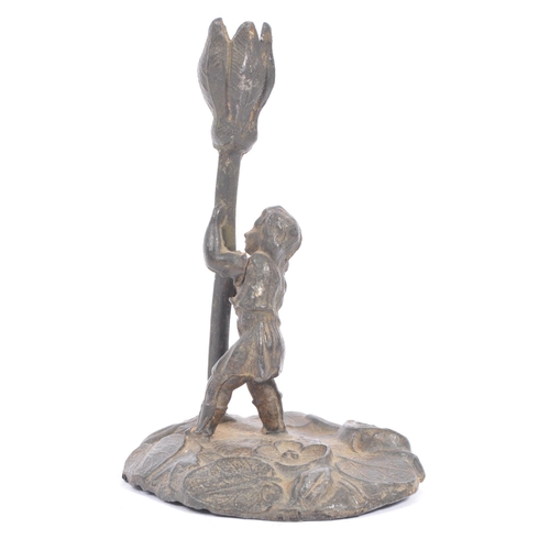 361 - A late 19th / early 20th century pewter 'Cecily Barker' style candlestick holder. Small boy / girl h... 