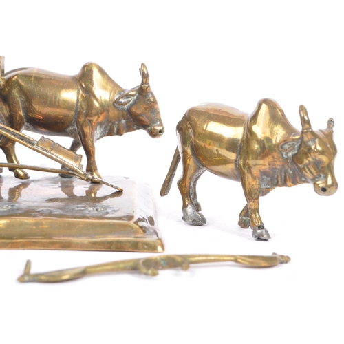 365 - A mid 20th Century brass deities Krishna cart diorama showpiece with buffalos. Measures 15.5cm x 15.... 