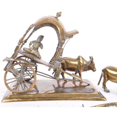 365 - A mid 20th Century brass deities Krishna cart diorama showpiece with buffalos. Measures 15.5cm x 15.... 