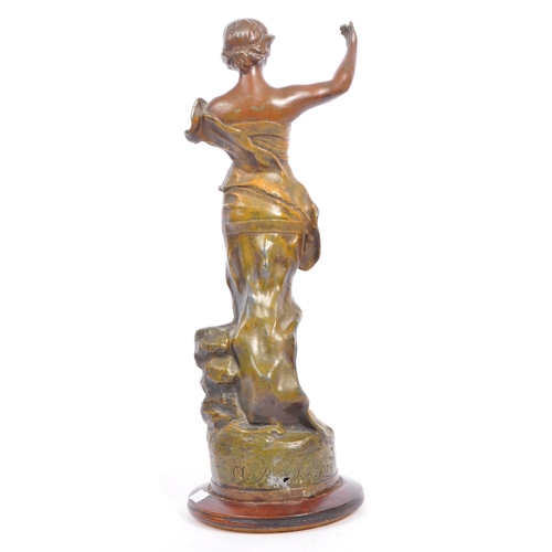 369 - A 20th century gold painted bronze female figure. The figure positioned atop a rock, with arm outstr... 