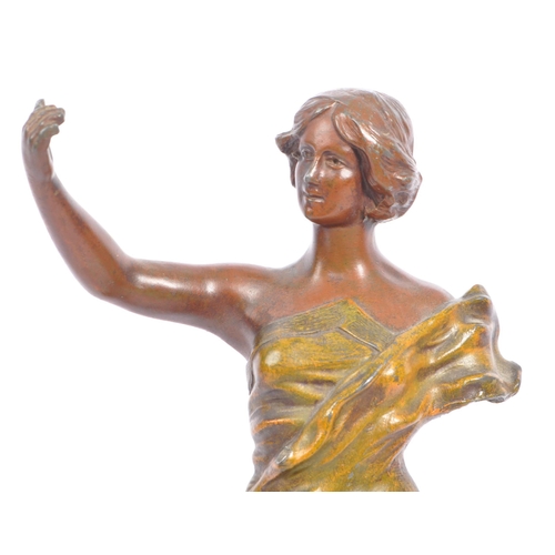 369 - A 20th century gold painted bronze female figure. The figure positioned atop a rock, with arm outstr... 