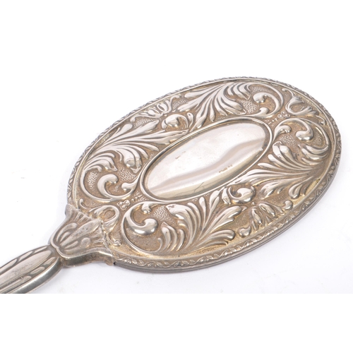 375 - A vintage 20th century Art Nouveau style silver plated vanity set. Comprising of clothes brush, hair... 