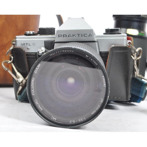 397 - Praktica - A collection of 20th century 35mm SLR film cameras and lenses. The collection to include ... 