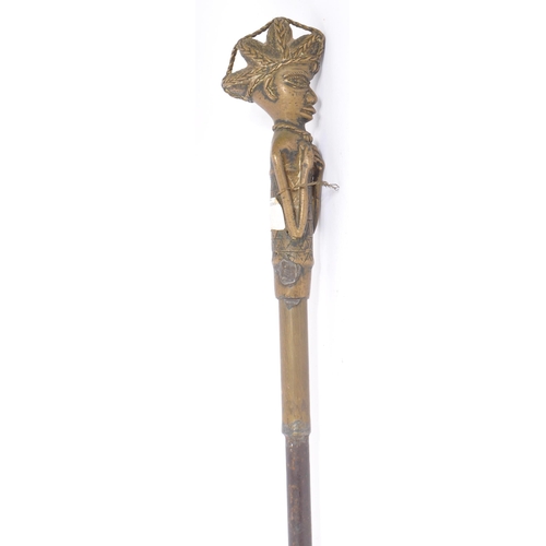 398 - Two early 20th century walking sticks / swagger canes. One example of metal construction with Africa... 