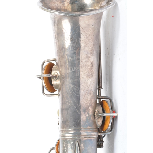 409 - Elkhart, Indiana - Pan American made Saxophone. A early 20th century vintage 20th century white meta... 