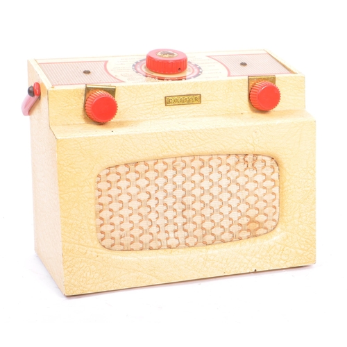 424 - A collection of four mid 20th century portable transistor radios. The collection to include examples... 