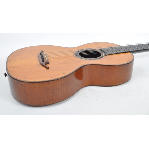 439 - A small proportioned 19th century handmade guitar. The guitar having a walnut body with bow back and... 