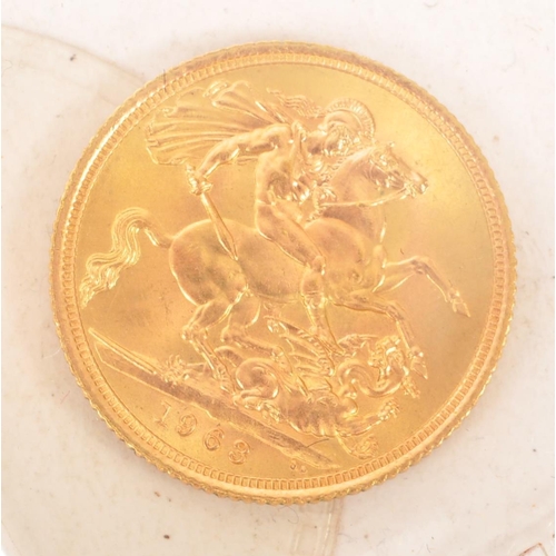 448 - A 1963 Queen Elizabeth II 22CT gold half sovereign, issued by the Royal Mint. The obverse features a... 