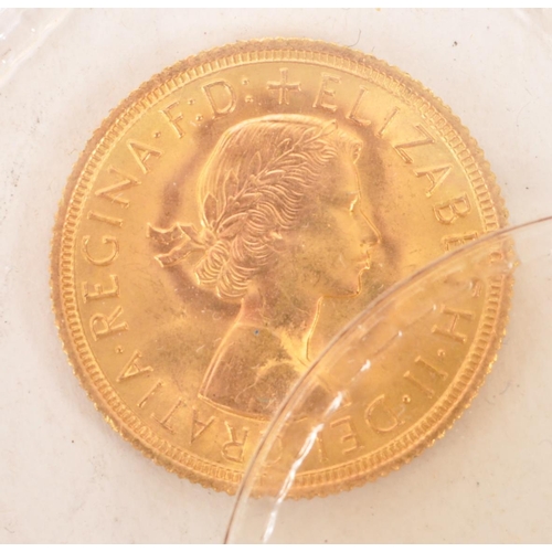 448 - A 1963 Queen Elizabeth II 22CT gold half sovereign, issued by the Royal Mint. The obverse features a... 