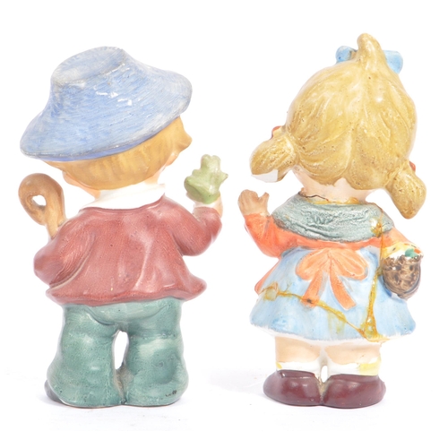 46 - W. Goebel - A collection of early 20th century German W. Goebel and other Hummel manner figurines. T... 