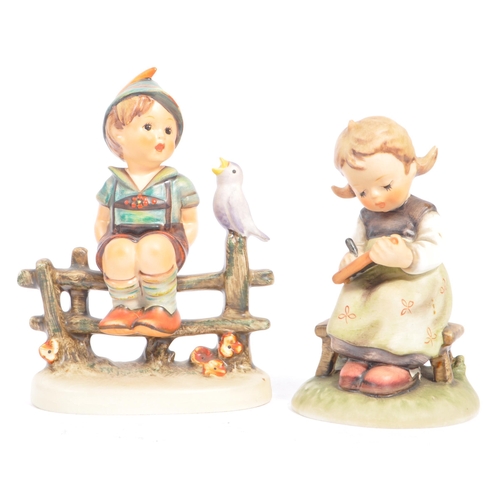 46 - W. Goebel - A collection of early 20th century German W. Goebel and other Hummel manner figurines. T... 