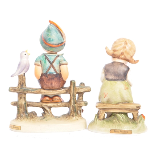 46 - W. Goebel - A collection of early 20th century German W. Goebel and other Hummel manner figurines. T... 