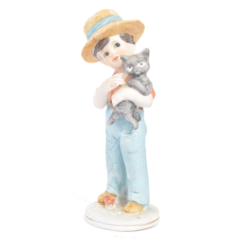 46 - W. Goebel - A collection of early 20th century German W. Goebel and other Hummel manner figurines. T... 