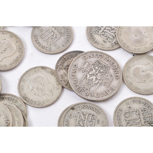 488 - A collection of 20th century pre 1947 British sixpence and shilling coins. The majority dating to 19... 