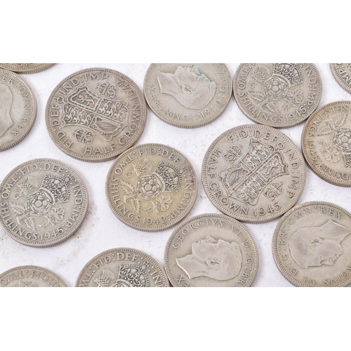 490 - A collection of 20th century British 1940s half crowns and two shilling coins. Total weight 450g.