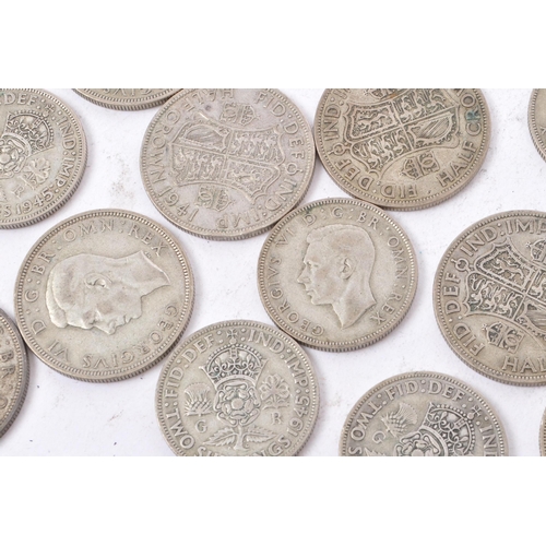 490 - A collection of 20th century British 1940s half crowns and two shilling coins. Total weight 450g.