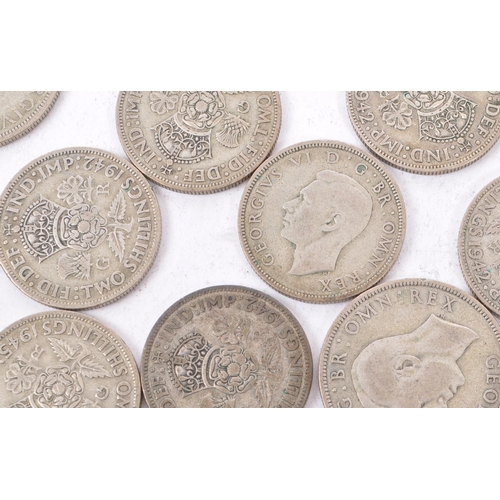 492 - A collection of 20th century 1922-1947 British half crowns and two shillings. Total Weight 354g.