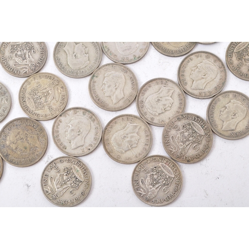 497 - A collection of 20th century 1922-1947 British shilling coins. Total Weight 322g.