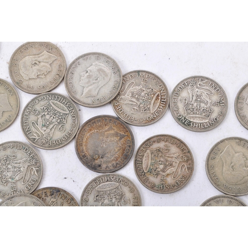 497 - A collection of 20th century 1922-1947 British shilling coins. Total Weight 322g.