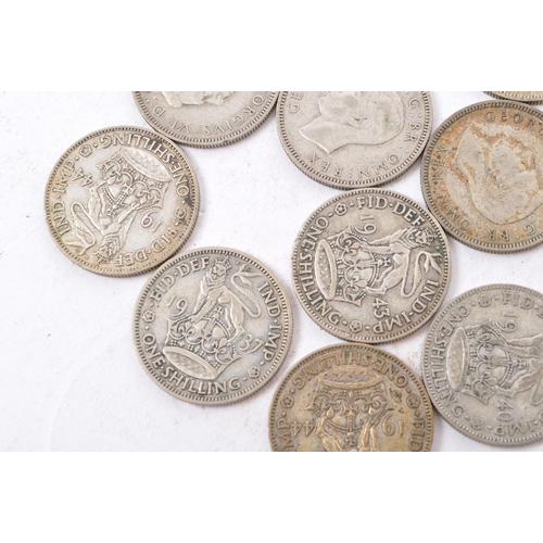 497 - A collection of 20th century 1922-1947 British shilling coins. Total Weight 322g.