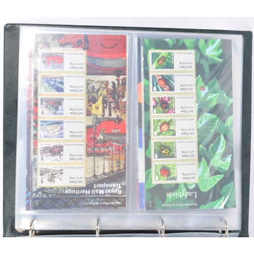 500 - A collection of 21st century British presentation pack commemorative stamps and Royal Mail post and ... 