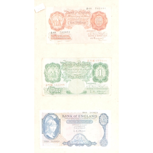 526 - A framed and glazed collection of early and mid 20th century British bank notes. The collection to i... 