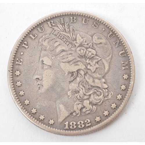 532 - A late 19th century 1882 .900 silver US United States Morgan dollar coin. The coin featuring Lady Li... 