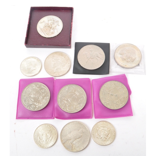 545 - A collection of 20th century British and American silver currency coinage. The collection to include... 