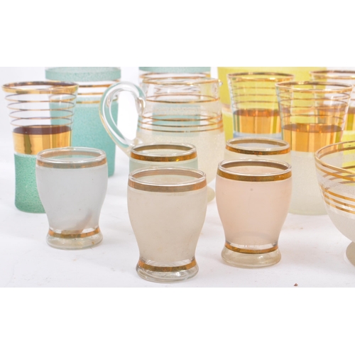 59 - A large collection of mid 20th century glassware / lemonade sets. The glassware all being of clear g... 