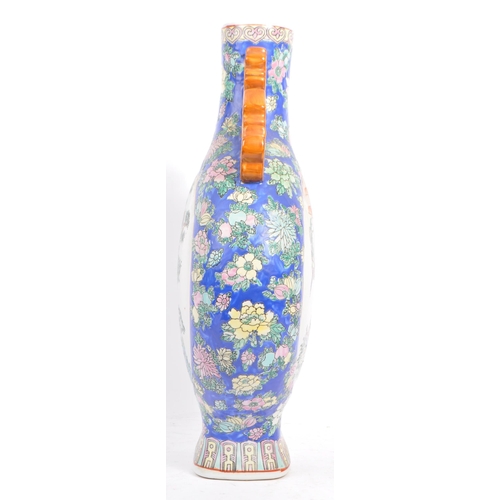 6 - An early 20th century Chinese twin handled porcelain moon flask vase. The vase having white central ... 