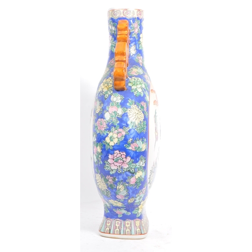 6 - An early 20th century Chinese twin handled porcelain moon flask vase. The vase having white central ... 