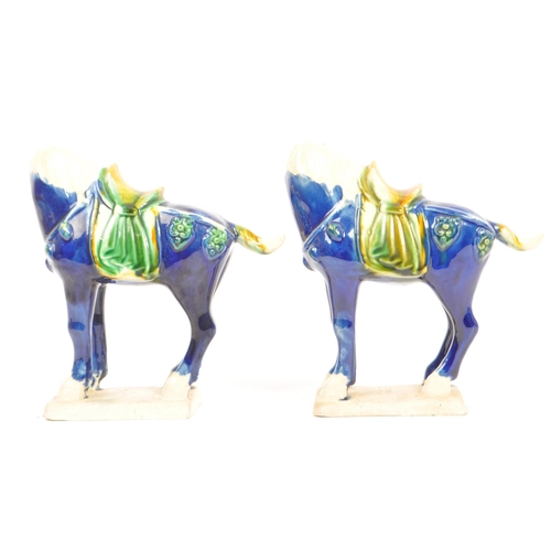 60 - Two ceramic later 20th century Chinese reproduction Tang dynasty style ceramic glazed war horse figu... 