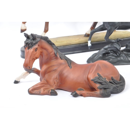 66 - Beswick - A collection of porcelain figurines in the form of horses. Three Beswick examples one with... 