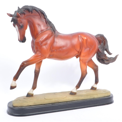 66 - Beswick - A collection of porcelain figurines in the form of horses. Three Beswick examples one with... 