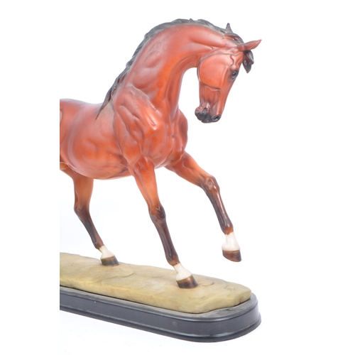 66 - Beswick - A collection of porcelain figurines in the form of horses. Three Beswick examples one with... 