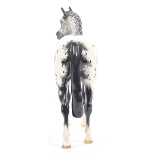 68 - Beswick - Appaloosa stallion - model No. 1772, black, white and mottled brown. Measures approx. 20cm... 