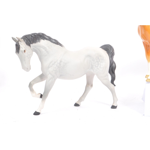 69 - Beswick - Three porcelain china horses Huntsman's Palomino, another example matt grey no. 1549 and b... 