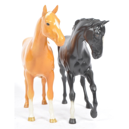 69 - Beswick - Three porcelain china horses Huntsman's Palomino, another example matt grey no. 1549 and b... 