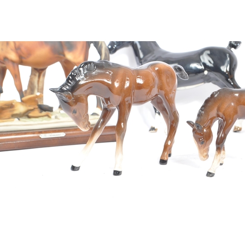 72 - Beswick - A collection of four porcelain china horse figurines. Comprising of a Black Hackney Horse ... 