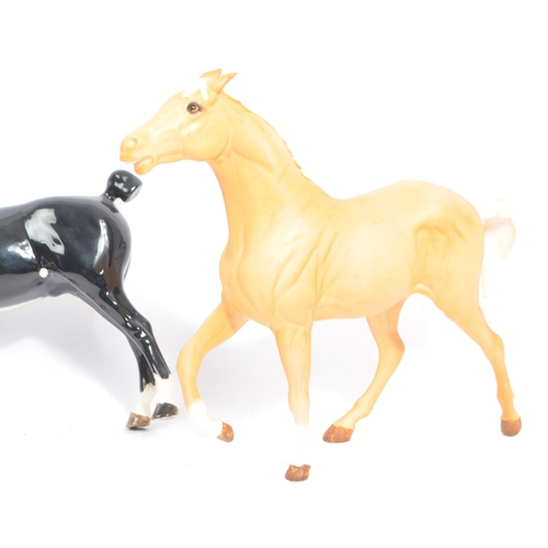 72 - Beswick - A collection of four porcelain china horse figurines. Comprising of a Black Hackney Horse ... 