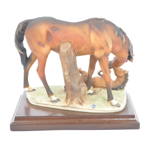 72 - Beswick - A collection of four porcelain china horse figurines. Comprising of a Black Hackney Horse ... 