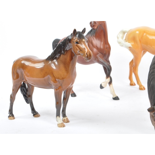 73 - Beswick - A collection of five porcelain china display horses. Comprising of palomino swing tail hor... 