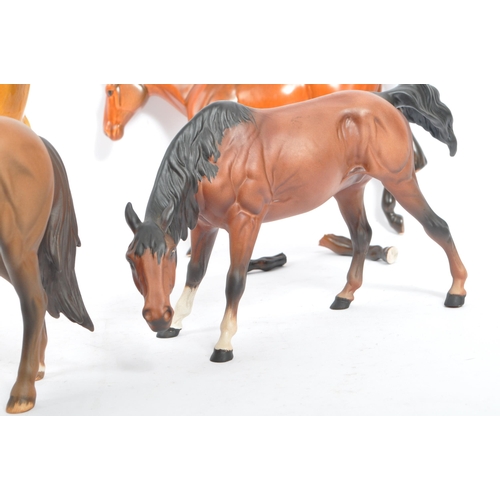 73 - Beswick - A collection of five porcelain china display horses. Comprising of palomino swing tail hor... 