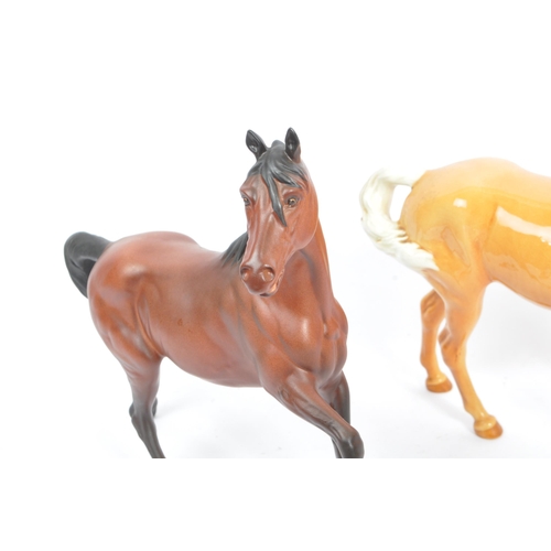 73 - Beswick - A collection of five porcelain china display horses. Comprising of palomino swing tail hor... 