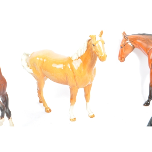 73 - Beswick - A collection of five porcelain china display horses. Comprising of palomino swing tail hor... 