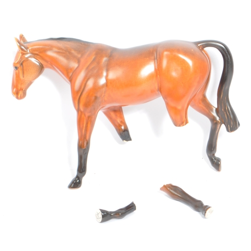 73 - Beswick - A collection of five porcelain china display horses. Comprising of palomino swing tail hor... 