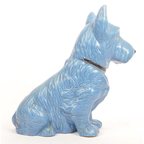 86 - Sylvac - A large fine bone china & ceramic seated dog animal figurines. In a blue colourway and mark... 